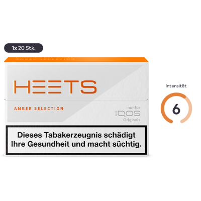 Nahaufnahme von HEETS Amber Selection Sticks, die perfekt in einem IQOS Gerät positioniert sind. Diese Sticks bieten eine ausgewogene Mischung aus sanften und intensiven Aromen.